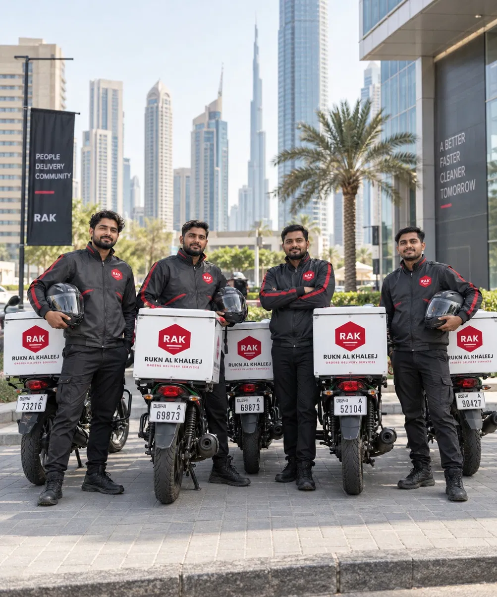 Team of four delivery riders standing with their motorcycles